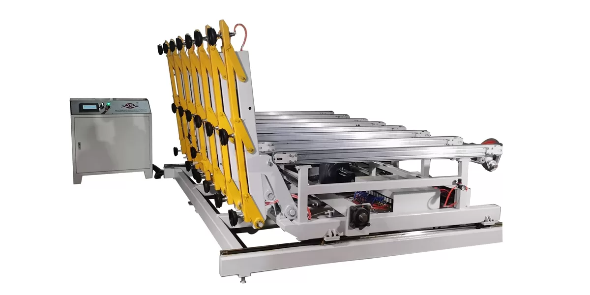 A 45-degree studio shot of the loading machine against a white background, highlighting the white metal frame, yellow articulated loading arms, and black suction cups.